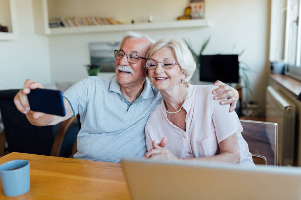istock Cheerful senior couple taking a selfie 1268086662