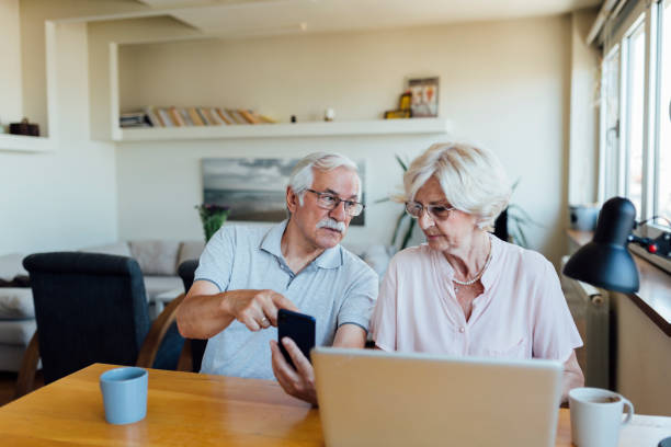 istock Senior couple working from home 1268086701