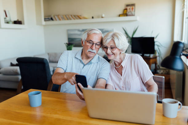 istock Senior couple working from home 1268086743