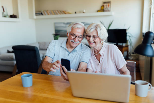 istock Senior couple working from home 1268086752