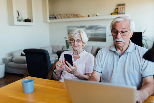 istock Senior couple working from home 1268087289