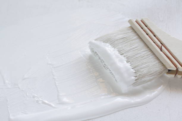 istock white paint color and paintbrush 1268089533