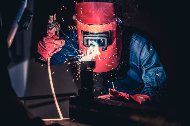 istock Metal welding steel works using electric arc welding machine 1268112767