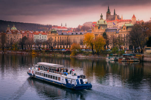 Prague panorama with boat at sunset – Czech Republic