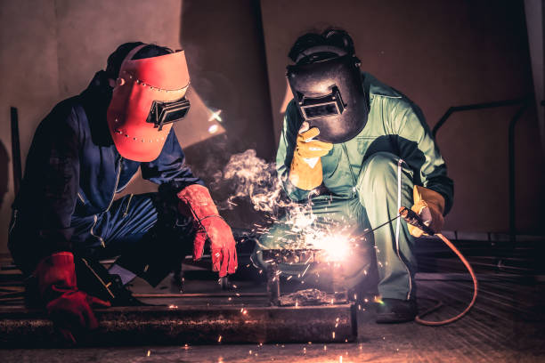 istock Metal welding steel works using electric arc welding machine 1268117834
