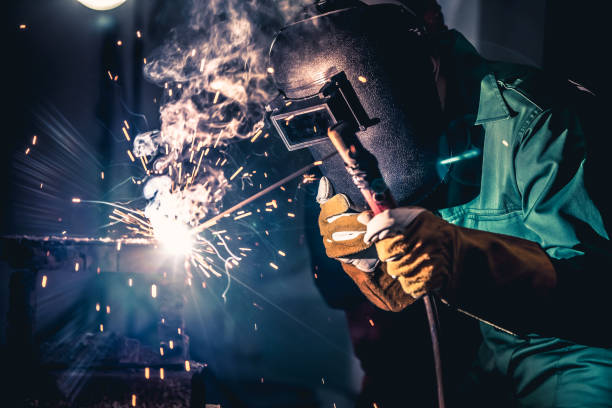 istock Metal welding steel works using electric arc welding machine 1268117875