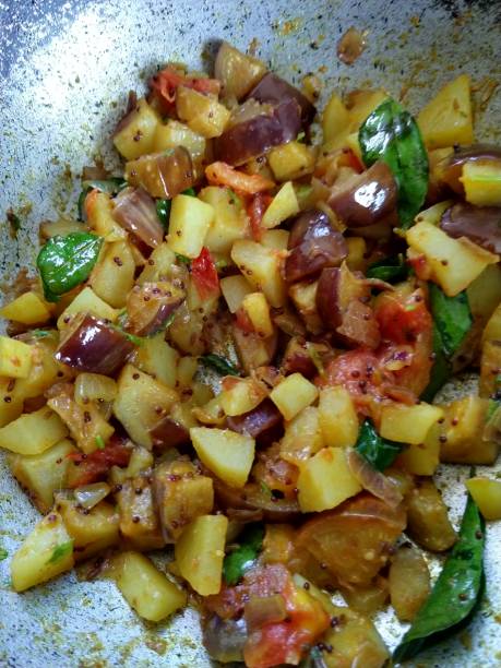istock Potato fry with onion and tomatoes 1268118700