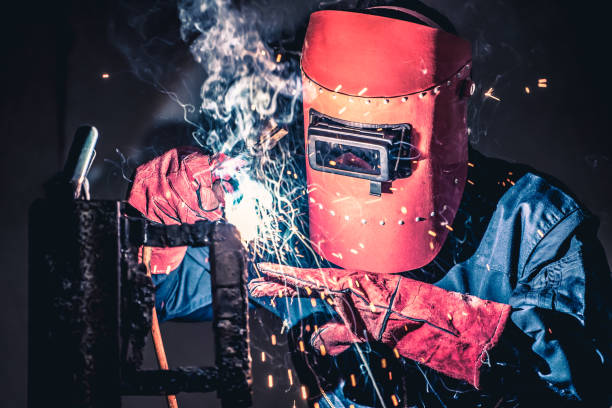 istock Metal welding steel works using electric arc welding machine 1268120650