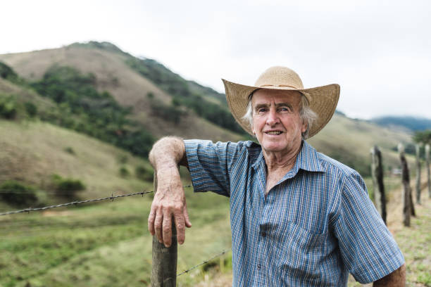 Brazilian farmer leaning on the fence