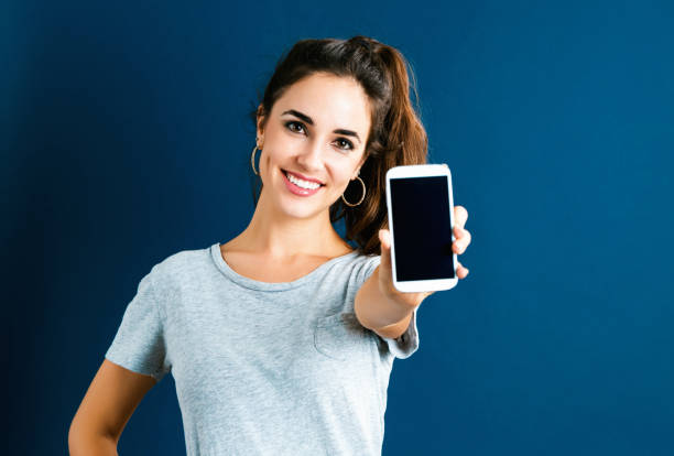 istock Young woman using her phone 1268128524
