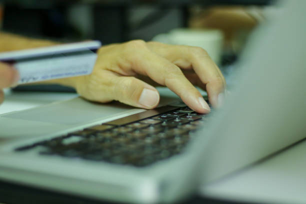 istock Single finger press on laptop keyboard, close up 1268137438