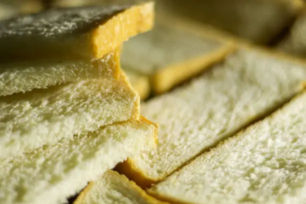 Photo of Closeup slide white bread from wheat