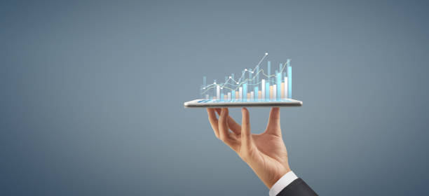istock Business plan graph growth increase of chart positive indicators in his business, tablet in hand 1268139399