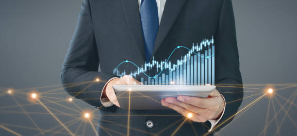 istock Business plan graph growth increase of chart positive indicators in his business, tablet in hand 1268139407