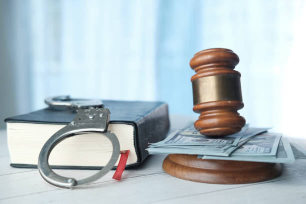 istock gavel, cash and handcuff on table, close up 1268142269