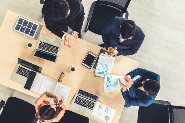 istock Successful business people celebrate together with joy 1268142824