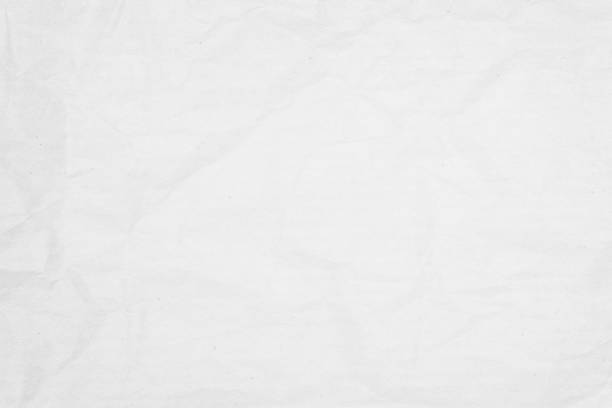 istock White recycled craft paper texture as background. Grey paper texture, Old vintage page or grunge vignette of old newspaper. Pattern rough art creased grunge letter. Hardboard with copy space for text. 1268142875