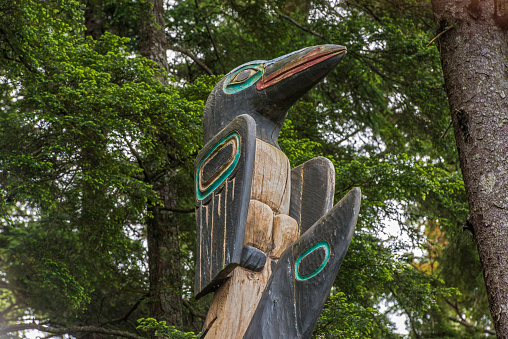 Raven/Shark totem pole at the Sitka National Historic Park on the  Totem Trail. Sitka Alaska.