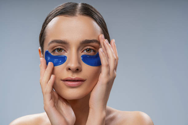 istock Tranquil young woman with under-eye gel pads 1268148968