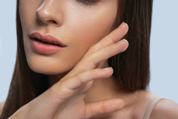 istock Placid lady touching her face with the right hand 1268148983