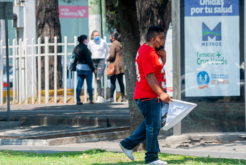 People requesting help in the streets of Guatemala City due to the COVID 19 pandemic, unemployed with white flags as a sign of poverty.