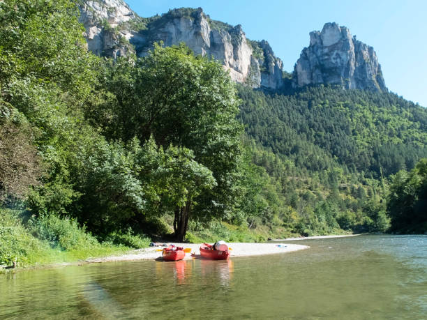 istock colorful kayaks ready to kayaking in spring river water. 1268153589