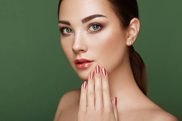 istock Beauty brunette woman with perfect makeup 1268155169