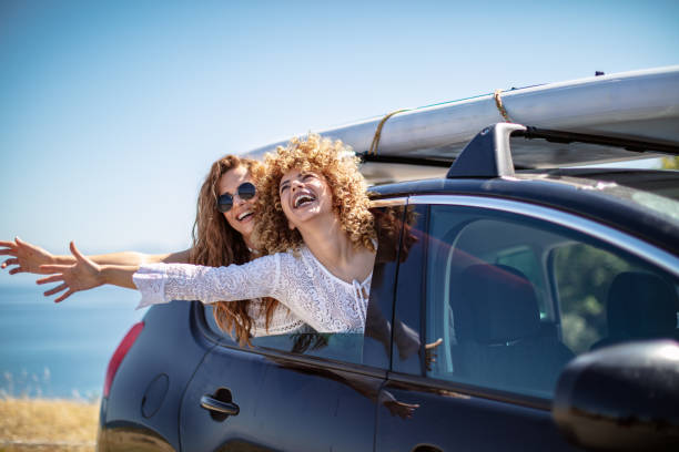 istock Friends having fun in car trunk 1268156055