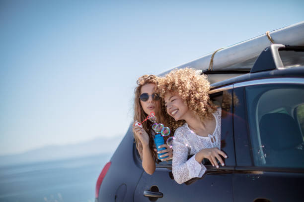 istock Friends having fun in car trunk 1268158626