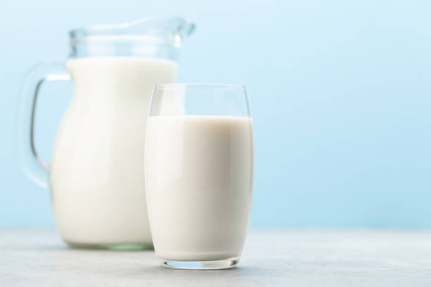 istock Milk jug and glass 1268162444