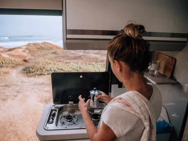 istock Woman making coffee in motorhome 1268164452