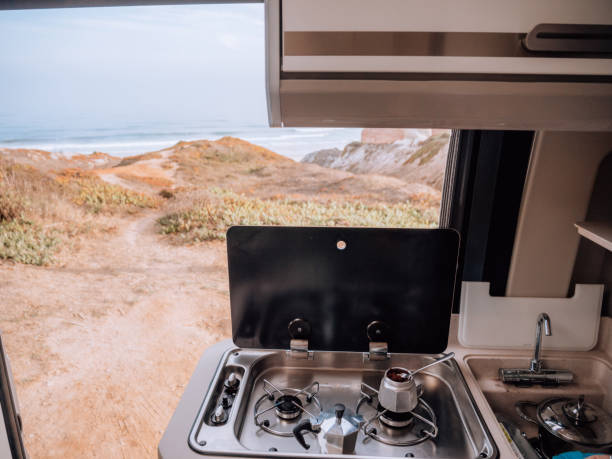 istock Coffee on stoves in motorhome overlooking ocean 1268164985