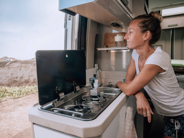 istock Woman making coffee in motorhome 1268164986