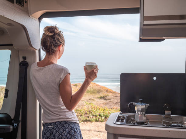 istock Waking up on the edge of a cliff, van life concept 1268164987
