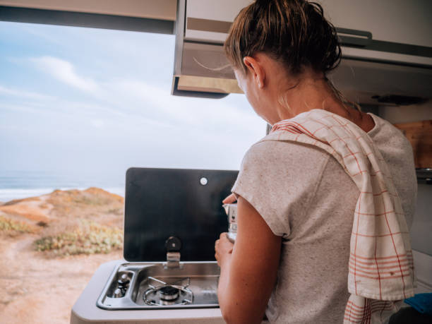istock Woman making coffee in motorhome 1268168732