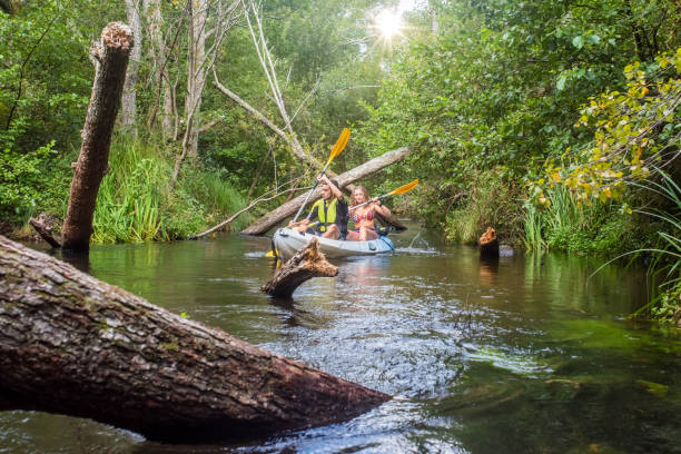 istock young couple kayaking down the river 1268169780