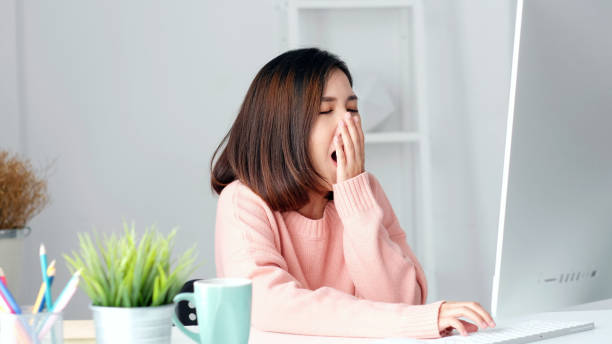 istock Working from home, Young asian woman yawn as exhausted from working with computer at home office, Asia girl overworked from study online class, Female people business, education technology lifestyle 1268172247