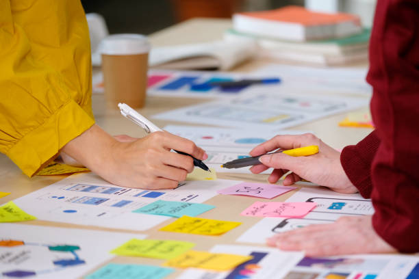 istock Brainstorm planing creative asian teamwork, Close up of hands asia mobile phone app developer team meeting for ideas about screen display prototype smartphone layout, ux startup small business, top view 1268172283