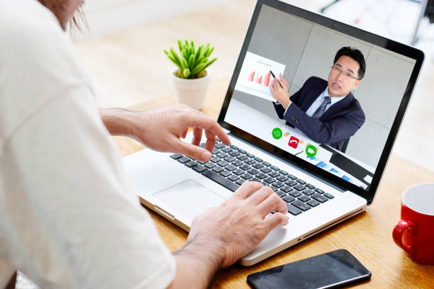 istock Video conference, Work from home, Businessman making video call to employee with virtual web, Contacting manager by conference on laptop computer at home, Talking on web, Online consultation  business 1268172289