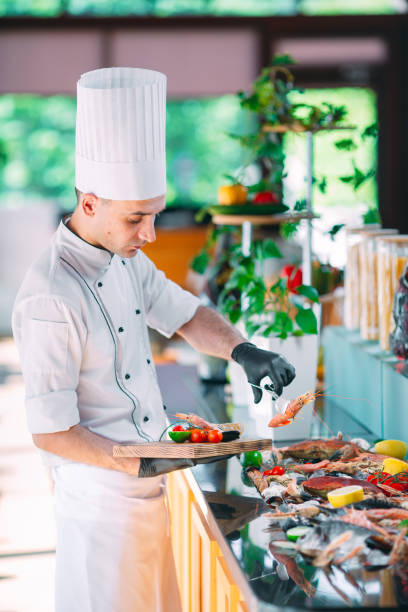 istock The Chef puts the seafood on a tray in the restaurant. 1268172361