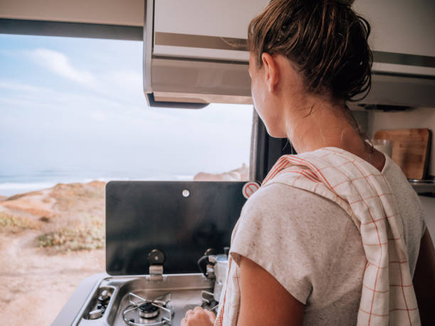 istock Woman making coffee in motorhome 1268174258