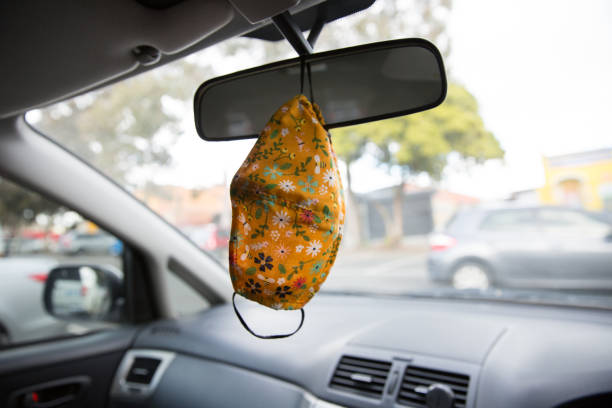 Floral Patterned Face Mask Hanging from the Rear View Mirror