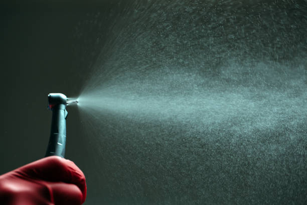 istock dental diamond cylinder bur with hand-piece and water spray. 1268174529