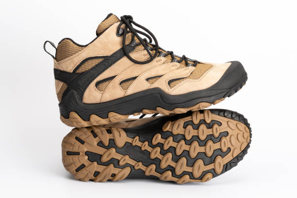 istock Light brown women's hiking shoes with a visible shoe sole 1268177728