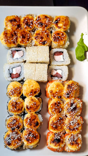 istock Bright sushi sets as background, top view, close-up 1268180984