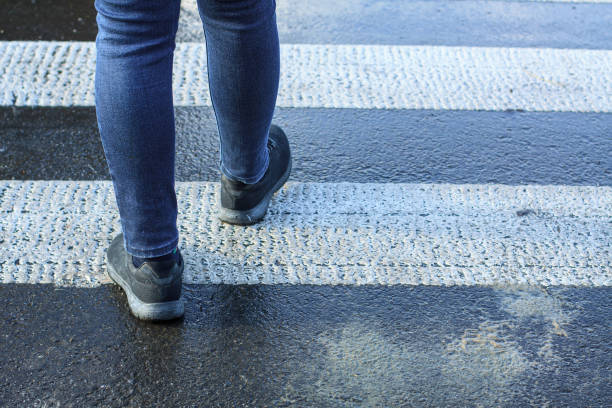 istock Pedestrian's feet at the crosswalk 1268182521