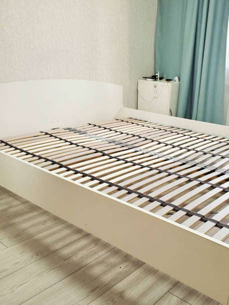 istock bed with orthopedic wooden base. assembling a bed in a room 1268183739