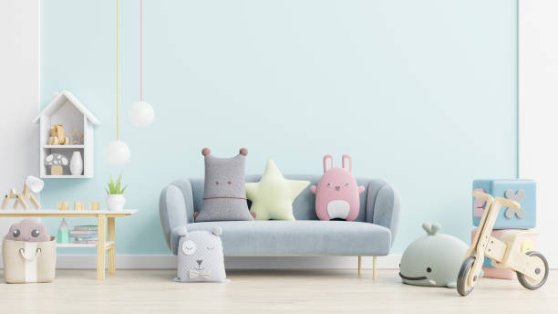 istock Blue sofa and doll,cute pillows in elegant child's room with mockup wall. 1268184270