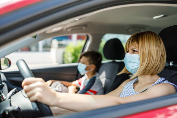 istock Mother taking son to school by car 1268184622