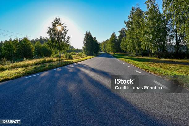 Early Sunrise Over Straight Road With Deminishing Perspctive Stock Photo - Download Image Now